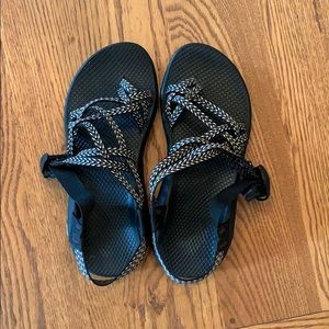 Black and white Chacos with toe strap. Size 8
